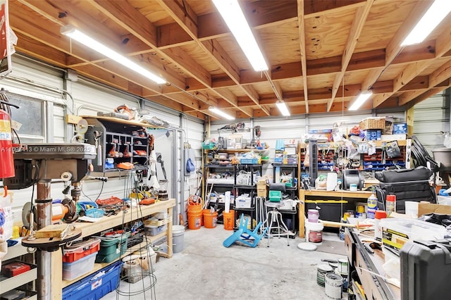 interior space with a workshop area and concrete floors