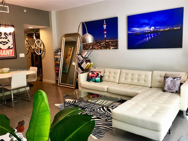 living room with tile patterned flooring