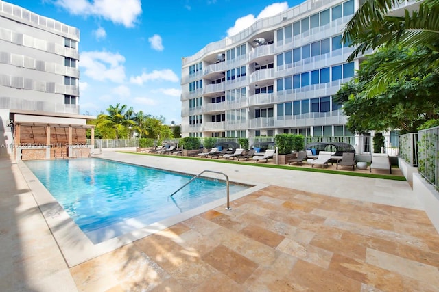 view of swimming pool featuring a patio area