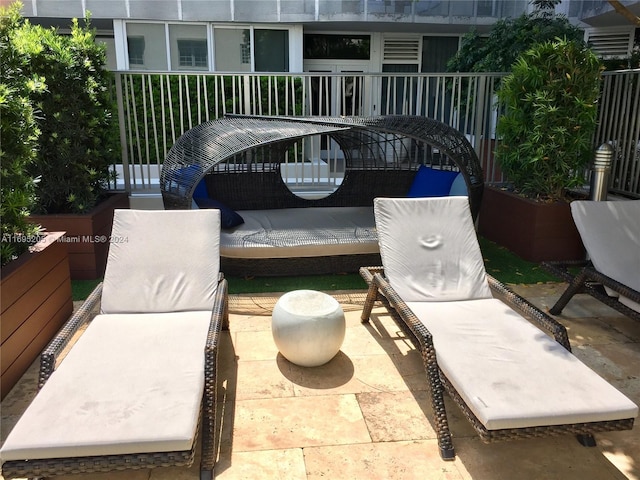 view of patio featuring a balcony