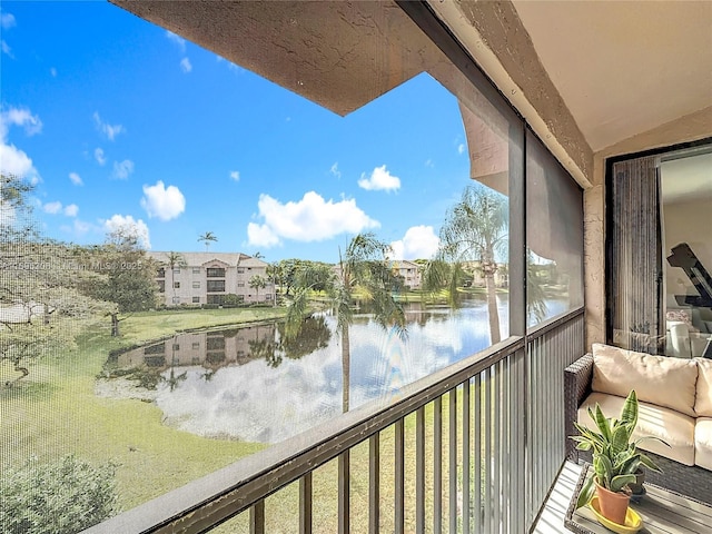 balcony featuring a water view