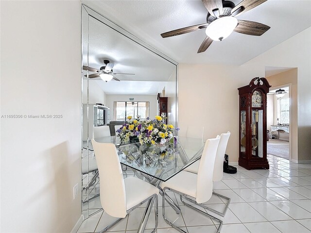 living room featuring light tile patterned floors and ceiling fan