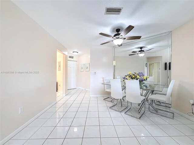 tiled foyer featuring a textured ceiling