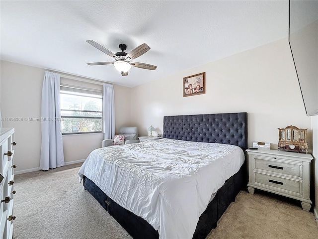 bedroom with light colored carpet and ceiling fan