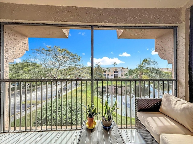 balcony featuring a water view