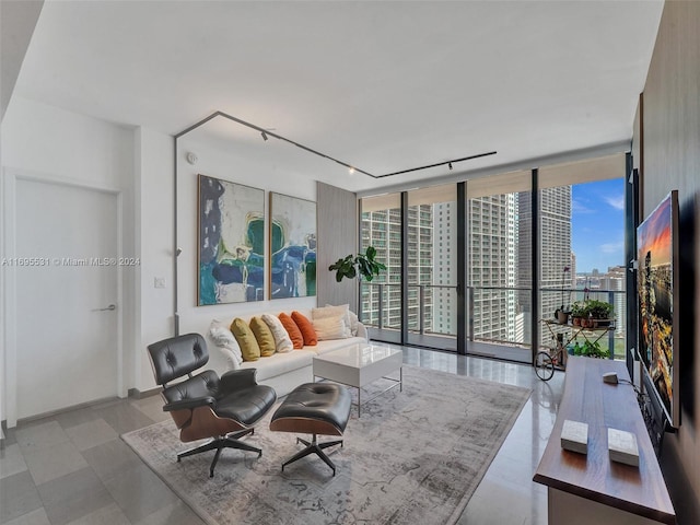 living room featuring floor to ceiling windows