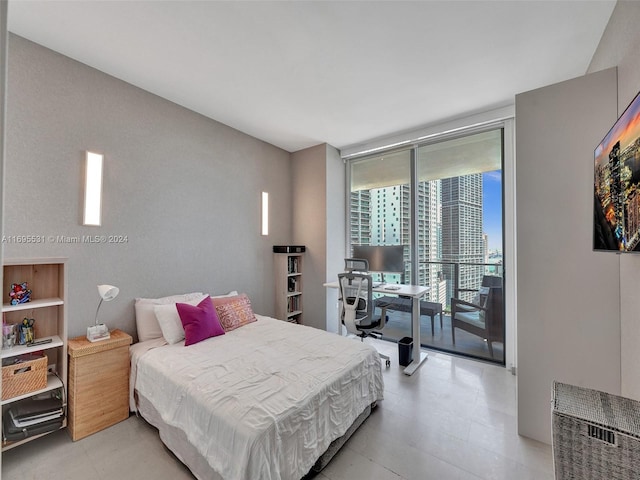 bedroom featuring access to outside and expansive windows