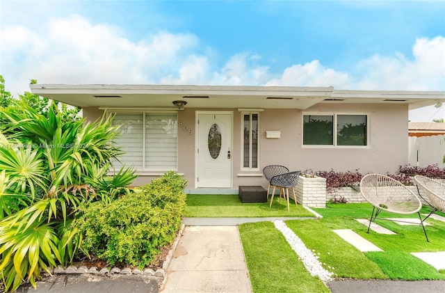 view of front of home with a front yard