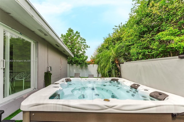 view of patio / terrace with a hot tub