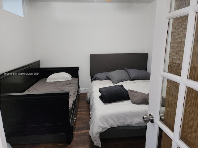 bedroom featuring dark wood-type flooring