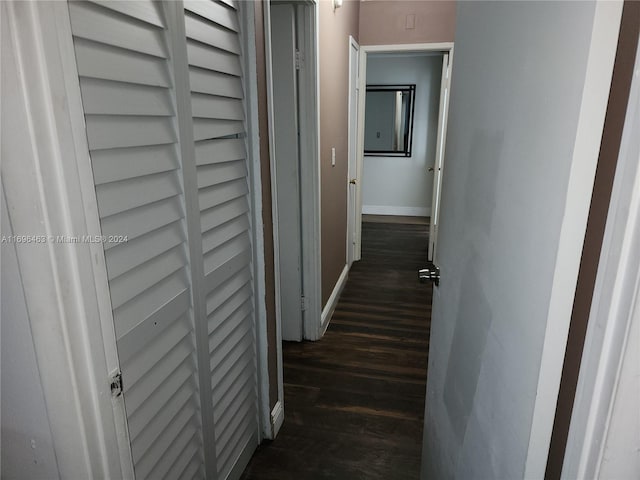 hallway featuring dark hardwood / wood-style floors