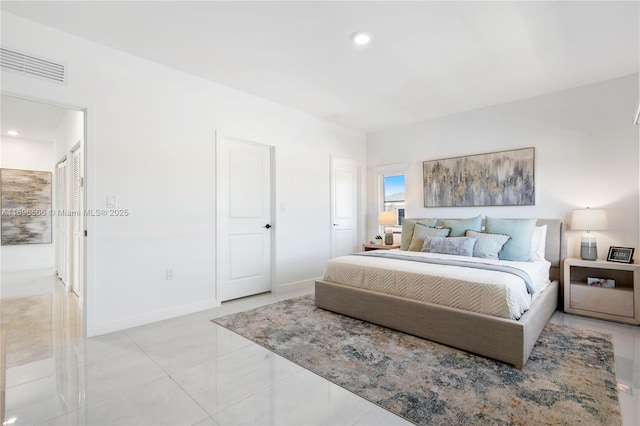 bedroom with light tile patterned flooring, visible vents, recessed lighting, and baseboards