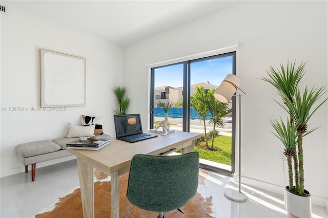 home office featuring visible vents and baseboards