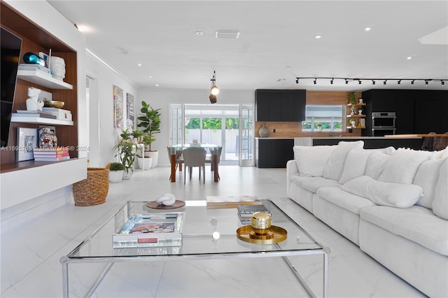 living room featuring crown molding