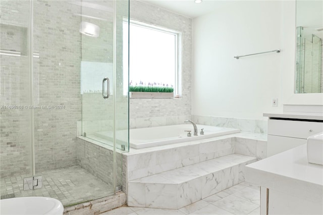 bathroom featuring vanity and separate shower and tub