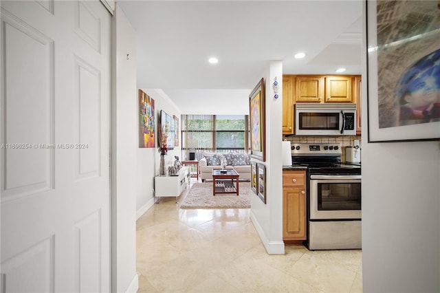 kitchen with backsplash and appliances with stainless steel finishes