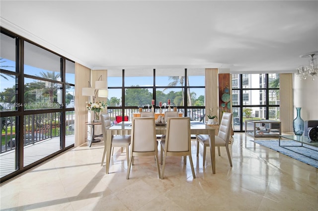 dining area featuring a chandelier and floor to ceiling windows