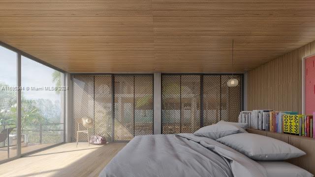 sunroom featuring wood ceiling