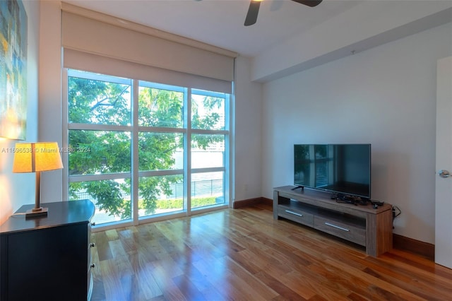 1945 S Ocean Dr Unit M5, Hallandale Beach, FL 33009 - living room with ceiling fan, healthy amount of natural light, wood finished floors, and baseboards