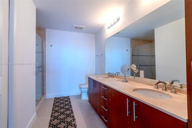 1945 S Ocean Dr Unit M5, Hallandale Beach, FL 33009 - bathroom with a shower stall, toilet, double vanity, and baseboards