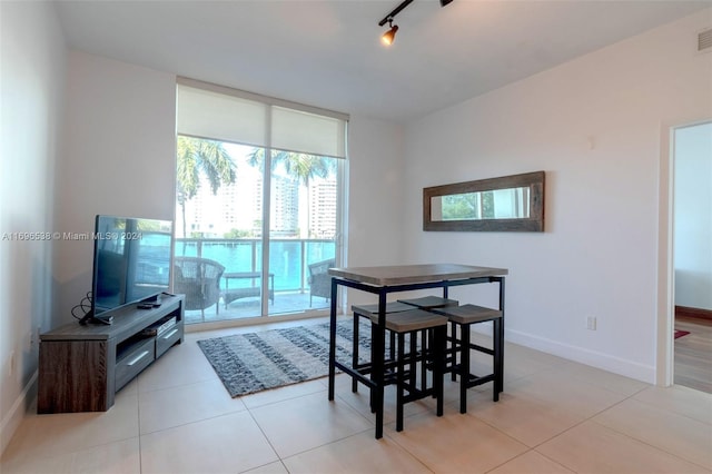 tiled dining space with track lighting