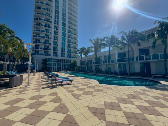 view of swimming pool with a patio