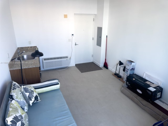 miscellaneous room with electric panel, a wall mounted AC, and sink