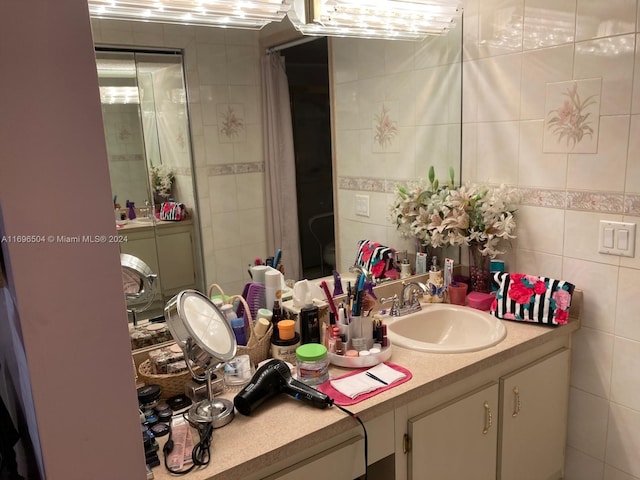 bathroom featuring vanity, tile walls, and a shower with shower curtain