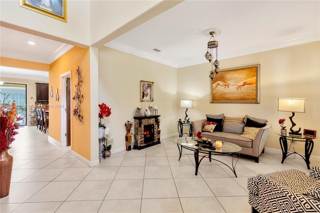 tiled living room featuring a stone fireplace and crown molding