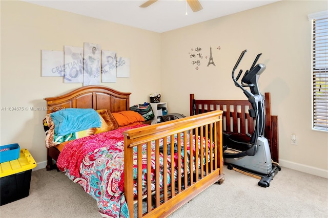 carpeted bedroom featuring ceiling fan