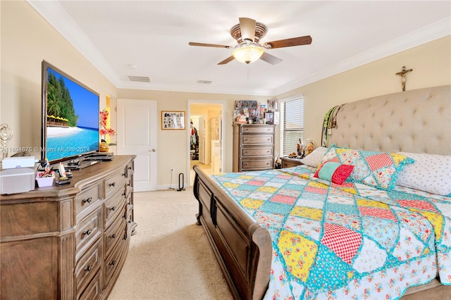 carpeted bedroom featuring ensuite bath, ceiling fan, and ornamental molding