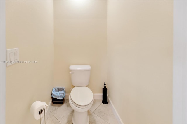 bathroom with tile patterned flooring and toilet