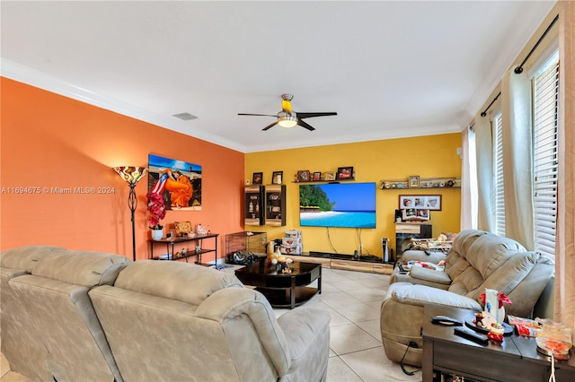 tiled living room featuring ceiling fan and crown molding