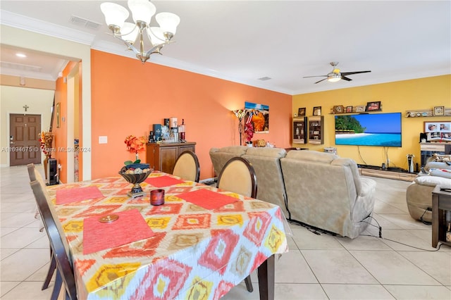 dining room featuring crown molding, light tile patterned flooring, and ceiling fan with notable chandelier