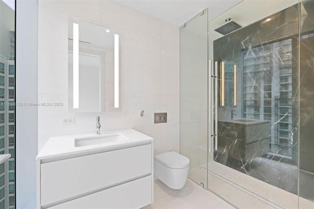 full bathroom featuring vanity, toilet, a marble finish shower, and tile walls