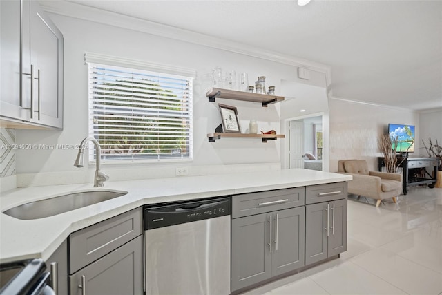 kitchen with gray cabinetry, sink, stainless steel appliances, light tile patterned flooring, and ornamental molding