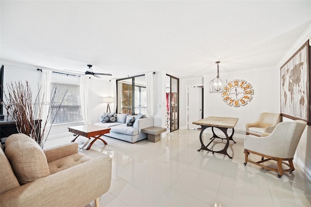 tiled living room featuring ceiling fan with notable chandelier and crown molding