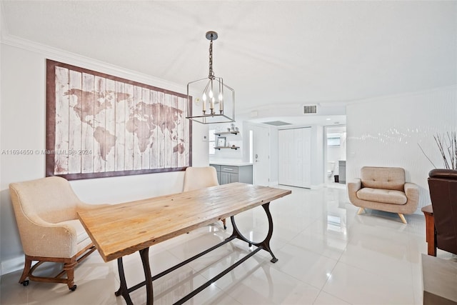 tiled dining area featuring a notable chandelier and ornamental molding