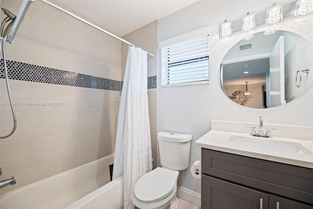 full bathroom with vanity, shower / bath combination with curtain, and toilet