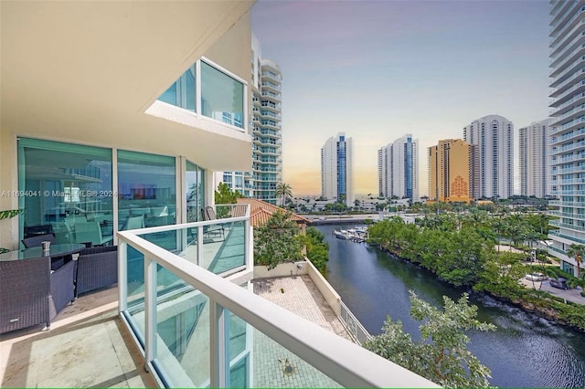 balcony featuring a water view