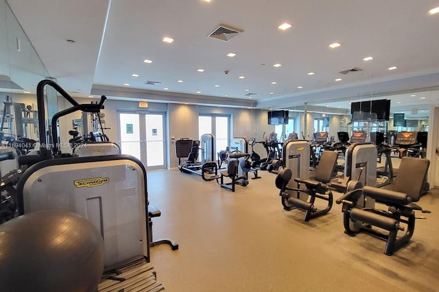 exercise room with ornamental molding