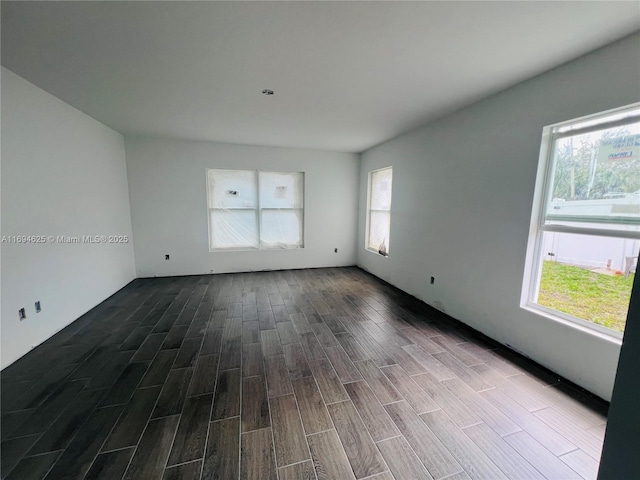 empty room with dark wood-style flooring