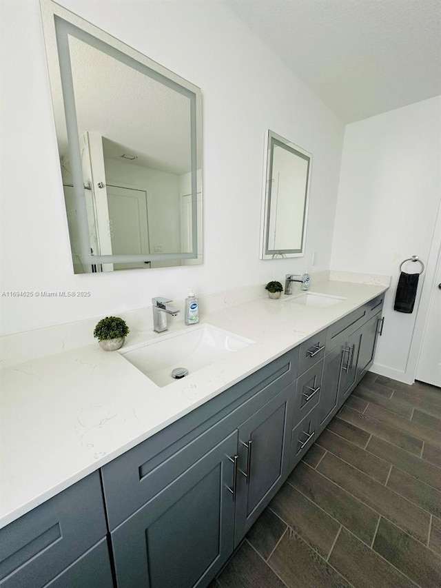 8036 104th Ct, Vero Beach, FL 32967 - full bath featuring double vanity and wood finish floors