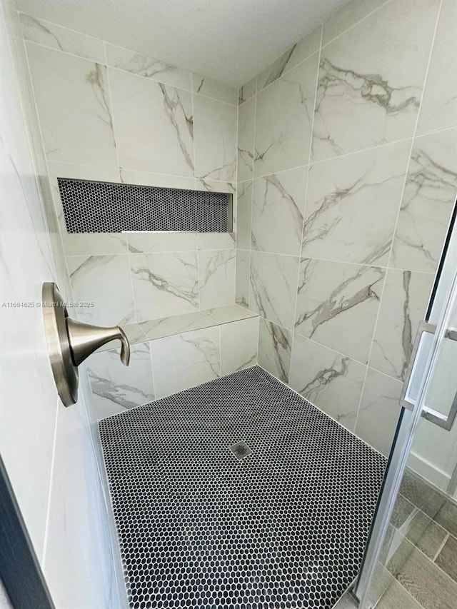 8036 104th Ct, Vero Beach, FL 32967 - bathroom with a stall shower and marble finish flooring