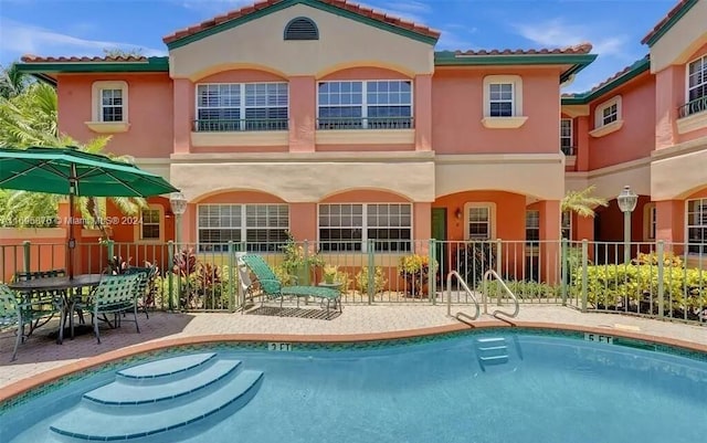 rear view of house featuring a patio