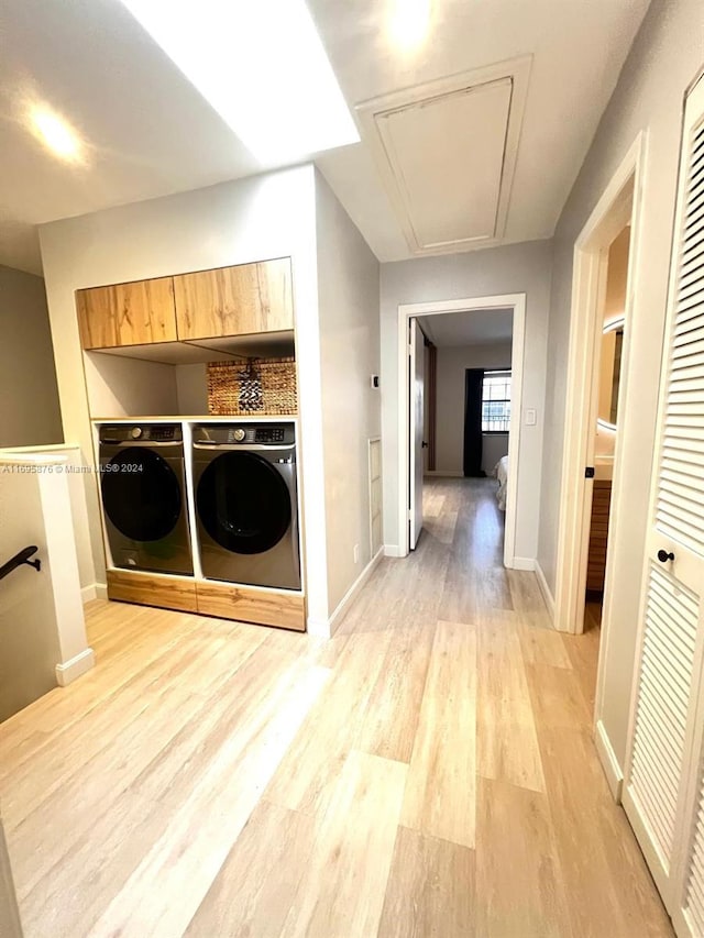 mudroom featuring light hardwood / wood-style flooring and washer and dryer