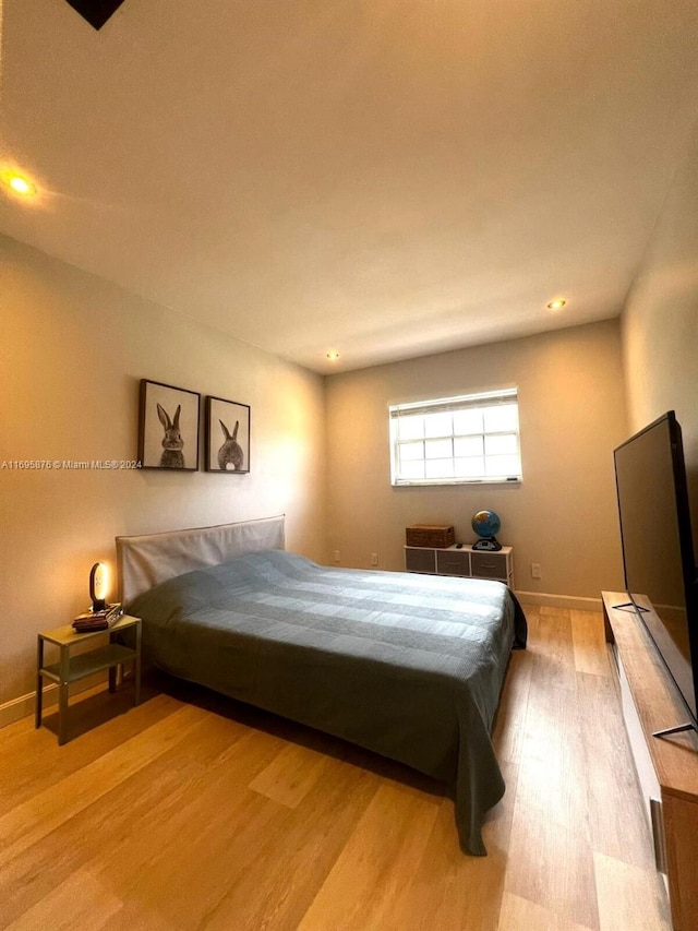 bedroom featuring light wood-type flooring