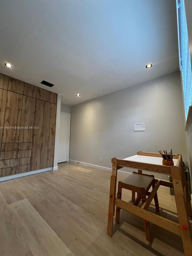 unfurnished room with light hardwood / wood-style flooring