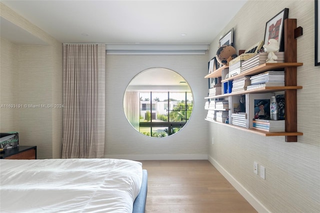 bedroom with light hardwood / wood-style flooring