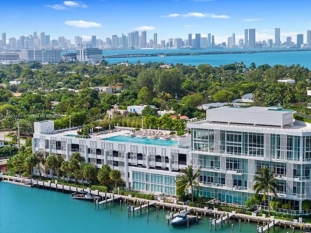 birds eye view of property with a water view